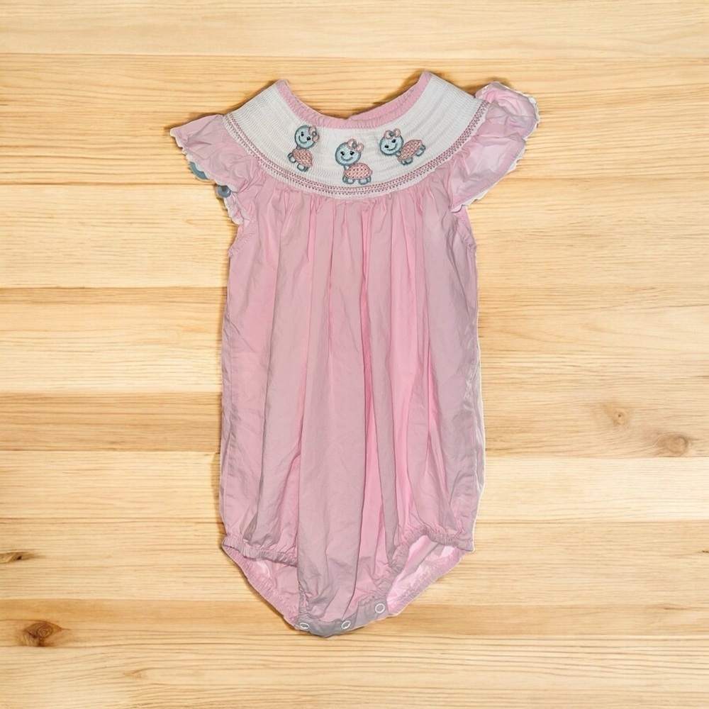 Pink baby girl's smocked bubble romper with embroidered turtle details 18-24m